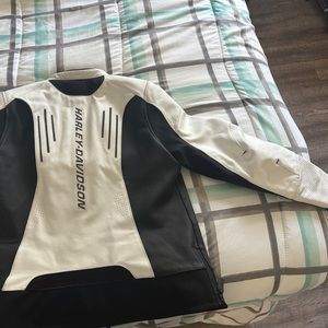 Black and white XL Harley Davidson jacket. Genuine leather w/ removable pads.